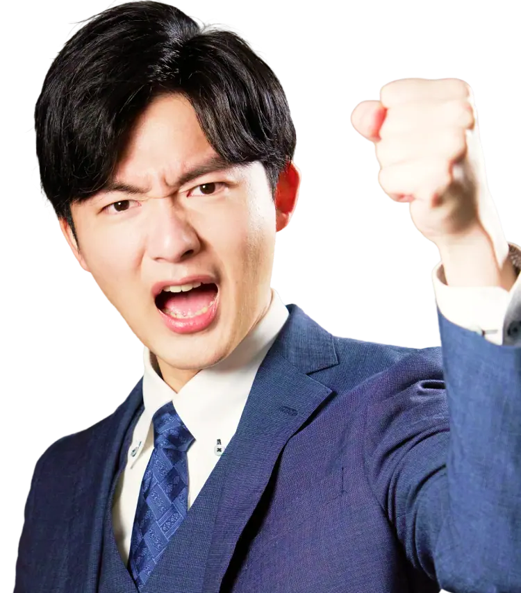 拳を突き出しているスーツの若い男性
